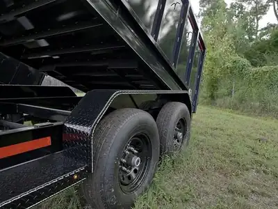 Dump bed raised over the tandem axles