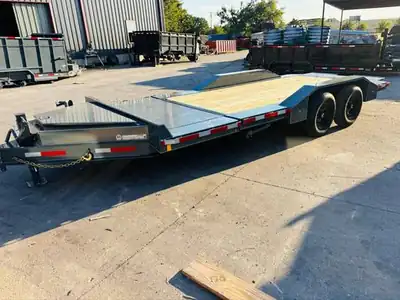Gray tilt-deck equipment trailer