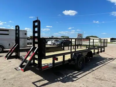 Equipment trailer with stand-up ramps