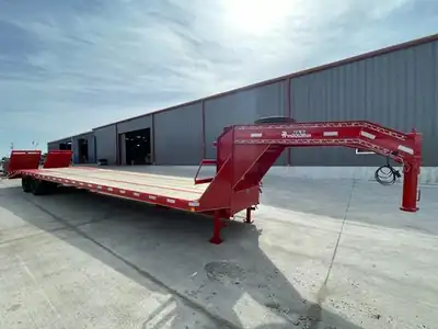Red gooseneck flatbed with the J&C decal