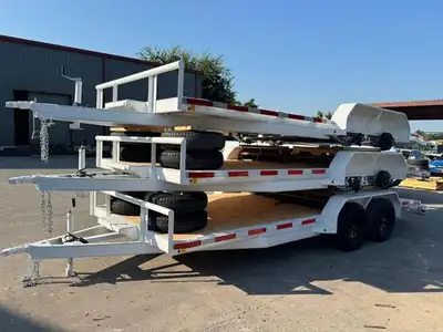 White car haulers stacked for delivery